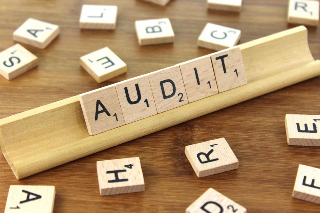 Scrabble letters spelling out the word "audit"