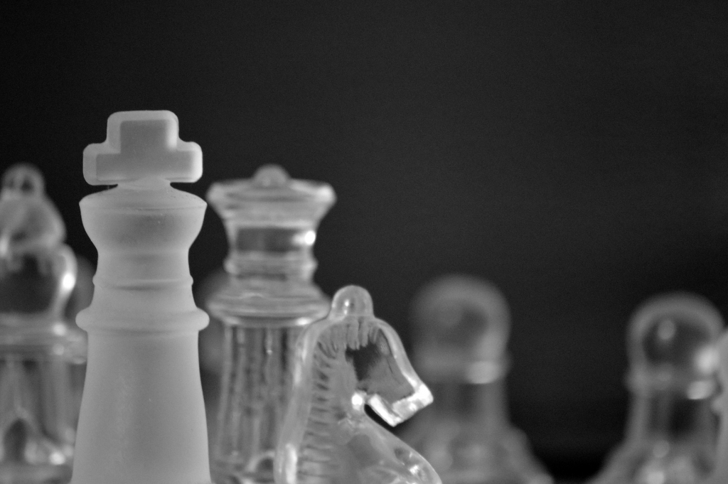 chess board with glass pieces, black and white