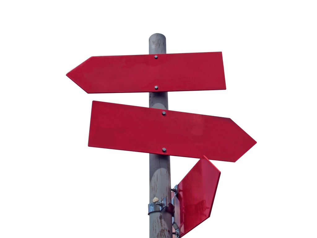 Signpost with red arrow pointing in different directions