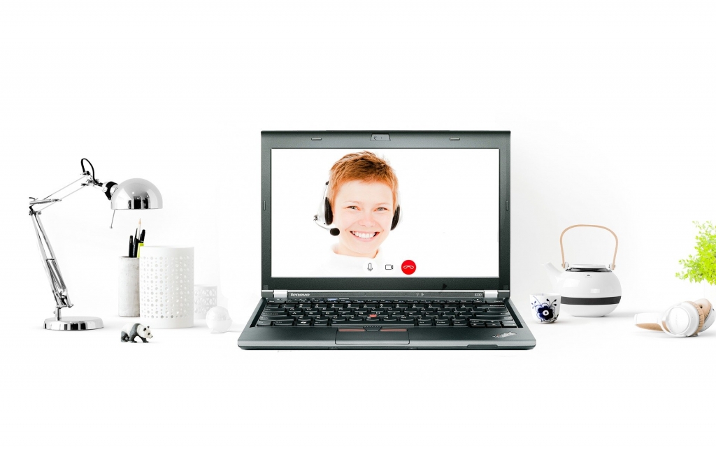 Laptop with lady with headset