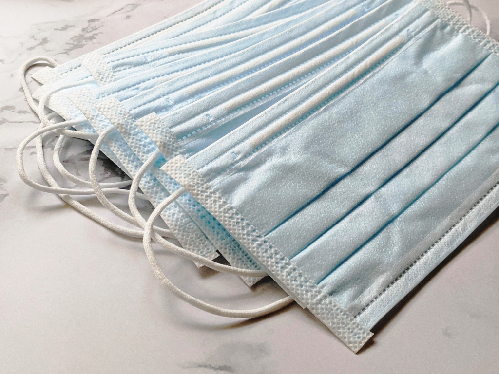 a pile of blue face masks