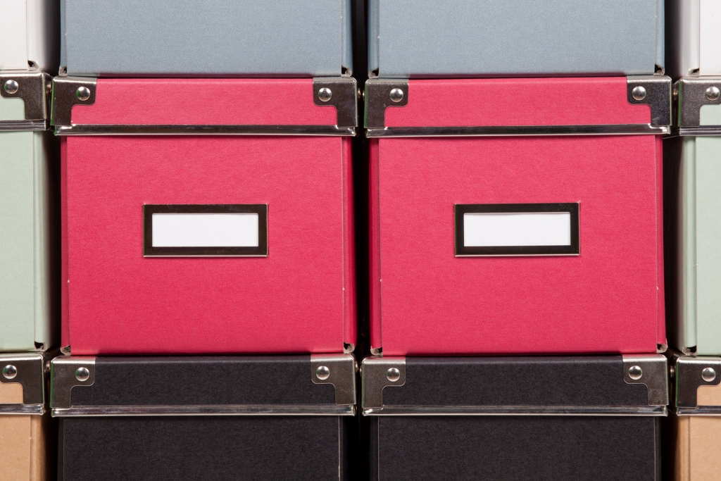 colorful cardboard boxes stacked one upon the other
